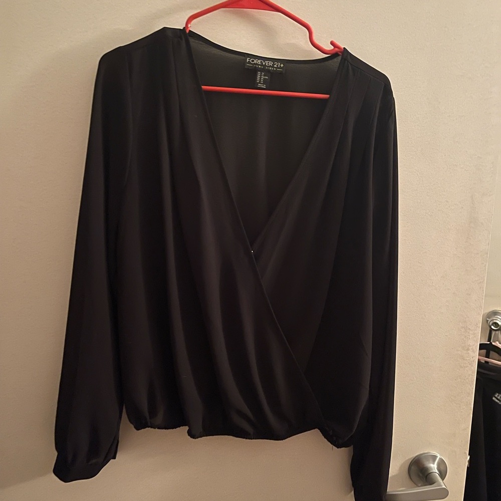 Sheer black long sleeve with plunging neck line!